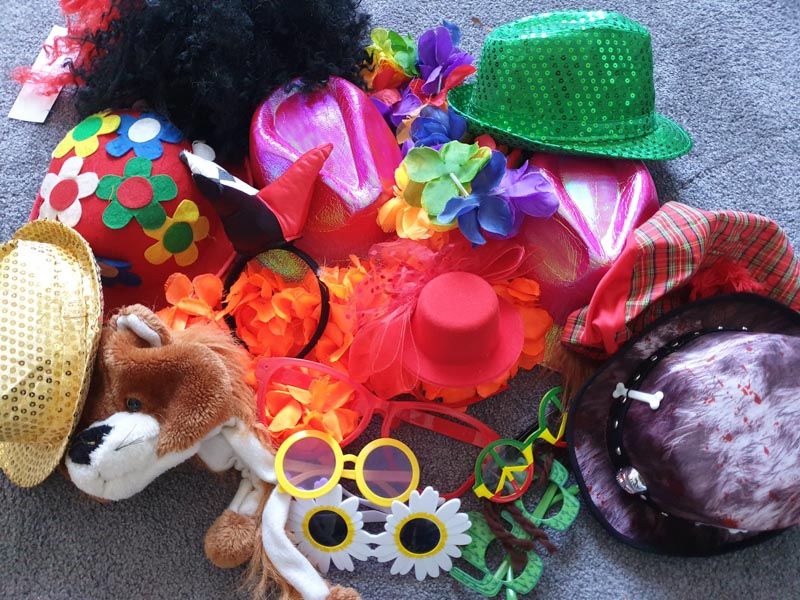 Photo booth props including hats, wigs and glasses